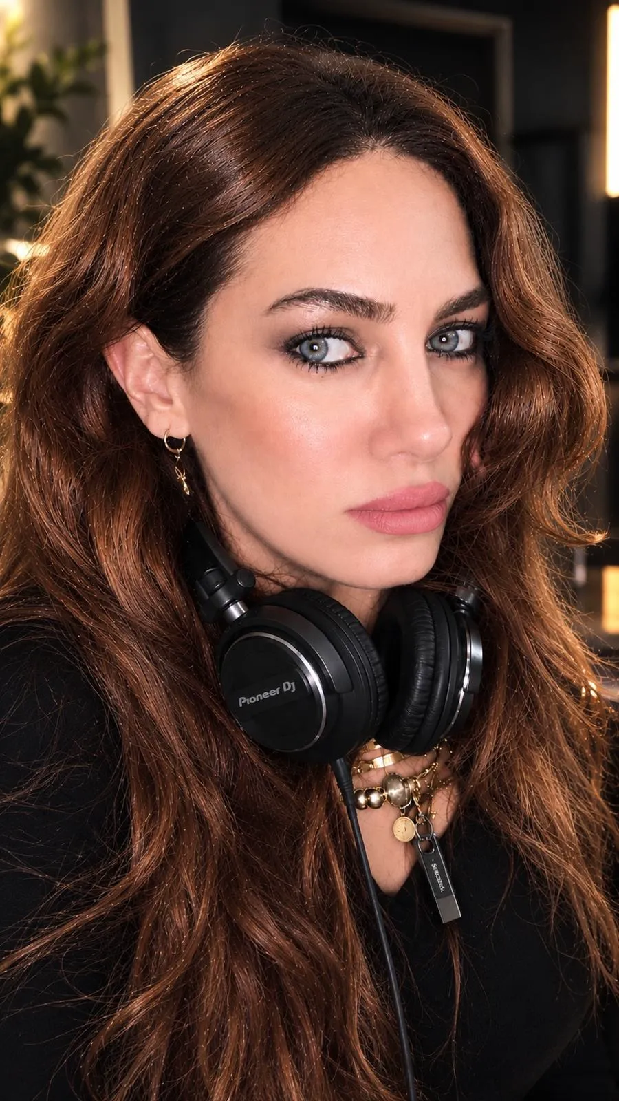Cansu Yücel portrait with Pioneer DJ headphones